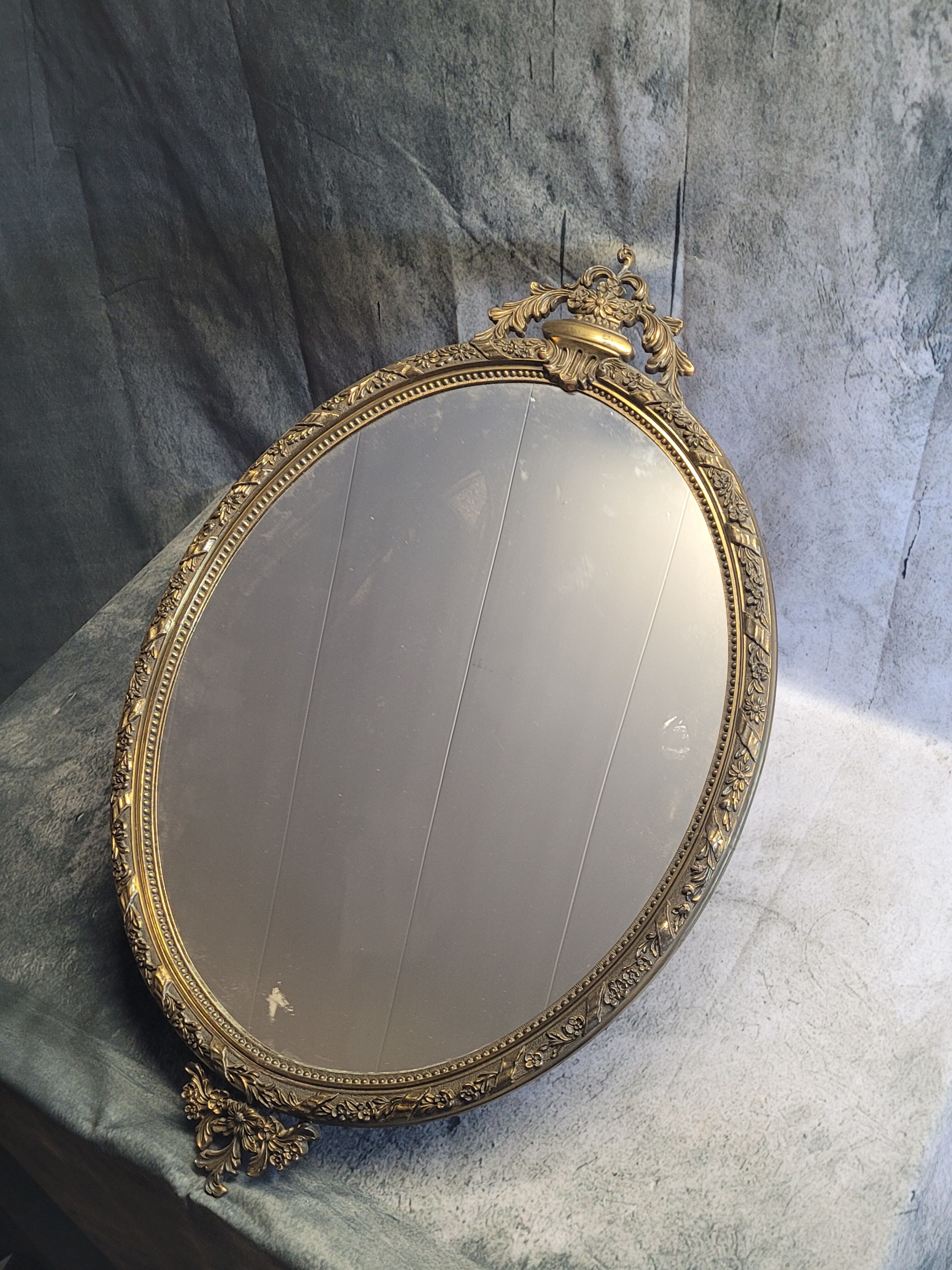 Gilded metal mirror in Louis XV style