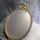 Miroir en métal doré de style Louis XV
