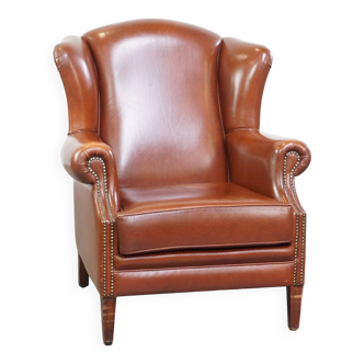 Fauteuil à oreilles de style anglais correct, confortable et luxueux en cuir de vachette couleur cognac
