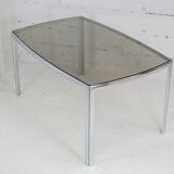 Living table. chrome metal, curved smoked glass slab, france, circa 1970.