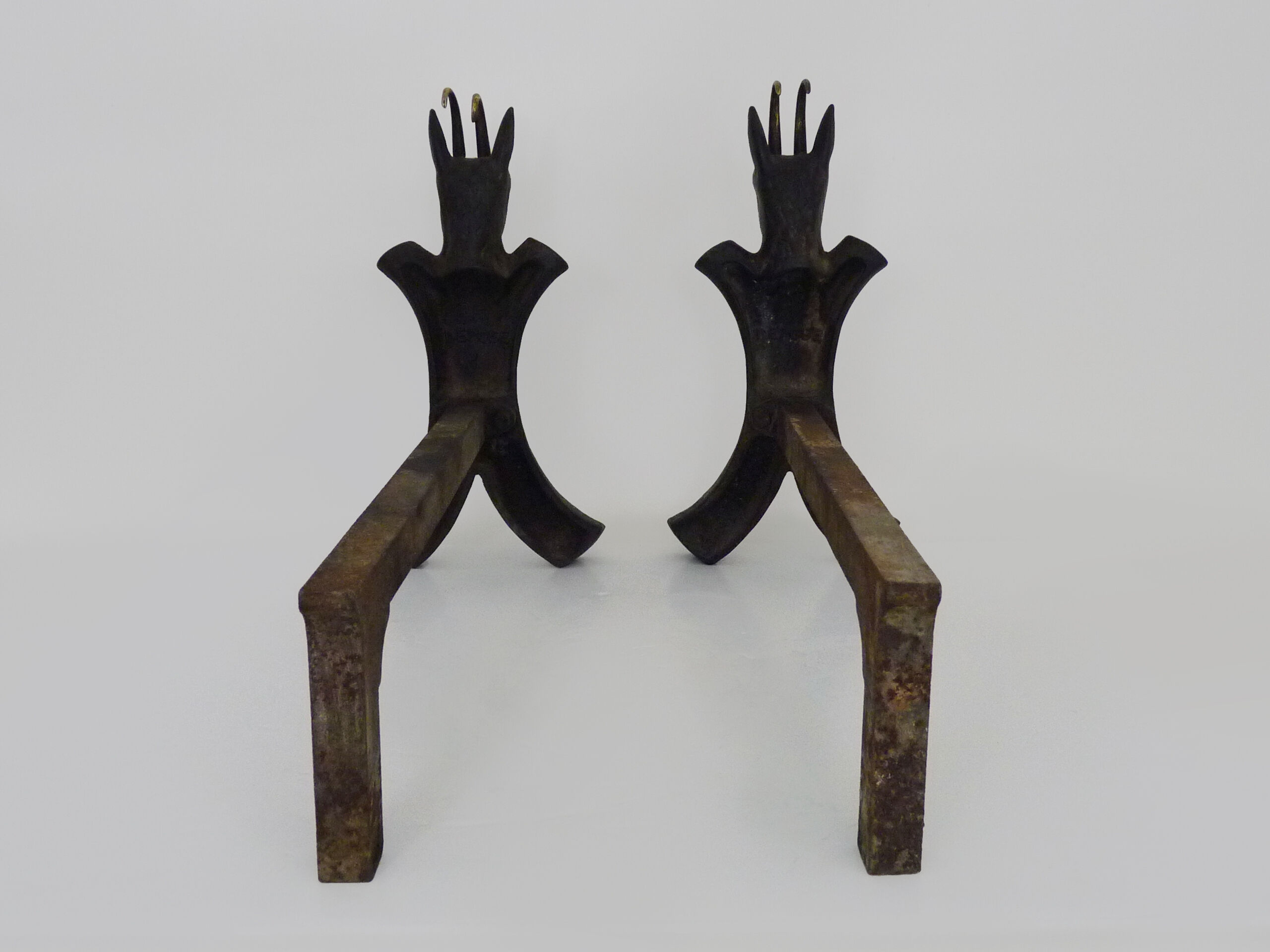 Pair of zoomorphic cast iron chimney pegs representing Isards. 50s