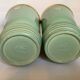 Pair of antique green and gold ceramic vases