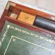 Antique hardwood military campaign desk with writing slope.