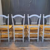 Series of 4 white straw chairs countryside