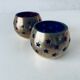 Pair of brass and glass tealight holders