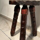 Brutalist sculpted tripod stool in solid wood — 1960s
