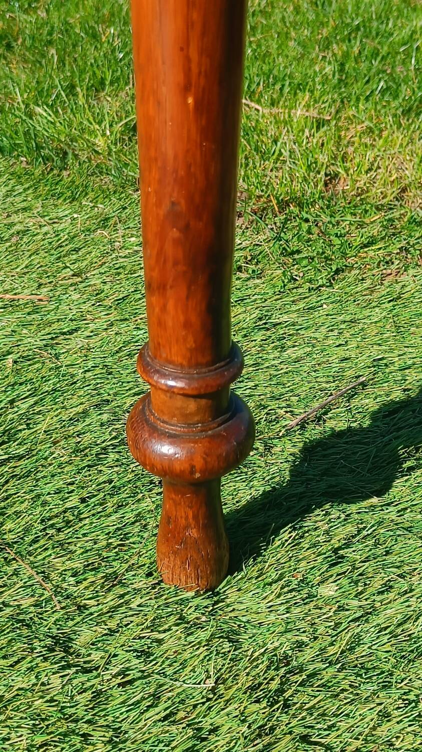 Antique solid wood table with a through drawer.