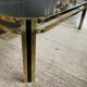 Table basse vintage années 70 en métal doré et verre fumé