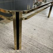 Vintage 1970s coffee table in gold metal and smoked glass.