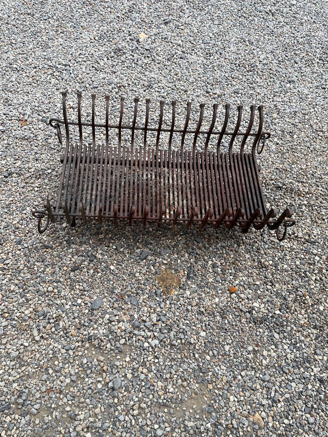 Vintage cast iron fireplace cradle with 16 bars.