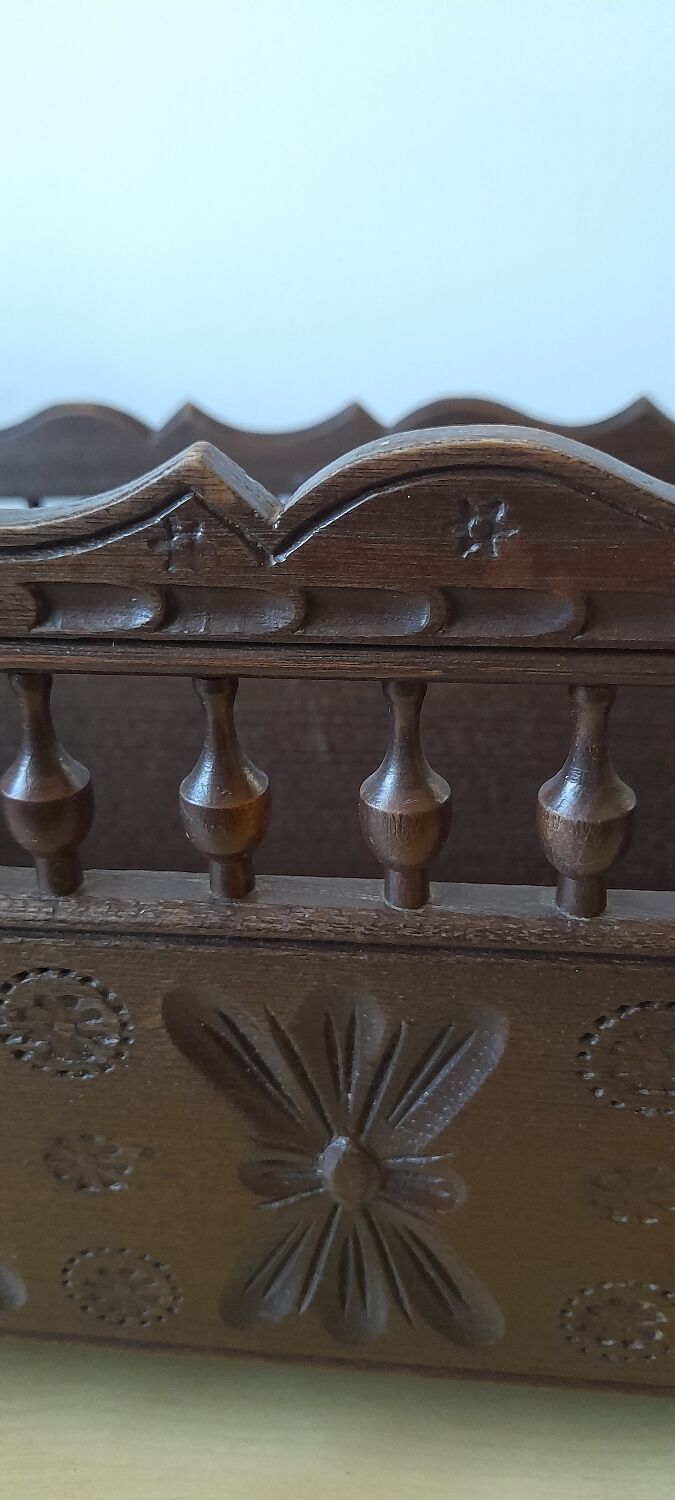 Carved wooden dolls cradle