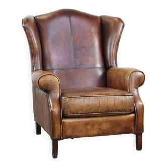 Fauteuil à oreilles en cuir de mouton