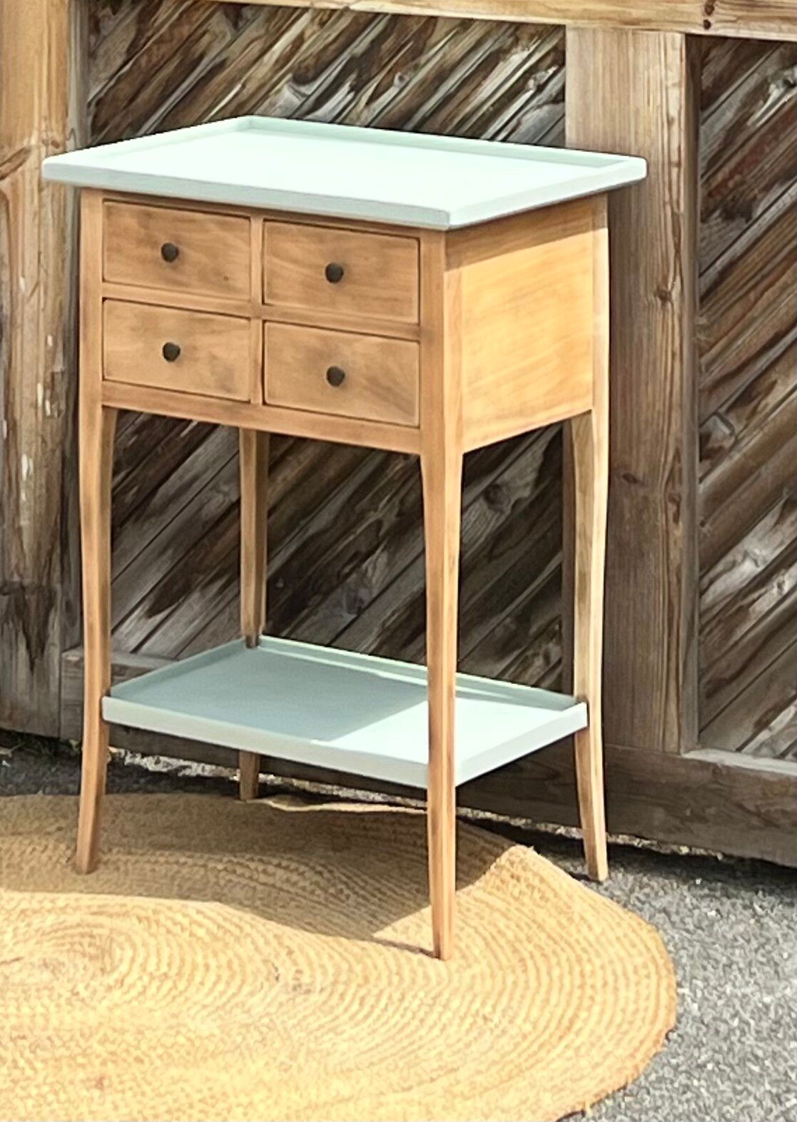 Raw wood console in water green with 4 drawers.
