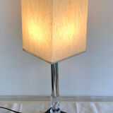Silver floor lamp with a straight shade.