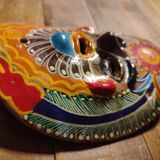 Mexican mask from the 1970s, hand-painted on terracotta.