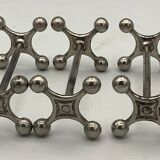 Set of 7 vintage knife rests in the shape of crosses in silver-plated metal.