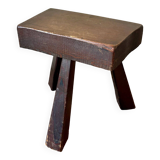Brutalist tripod stool in dark wood