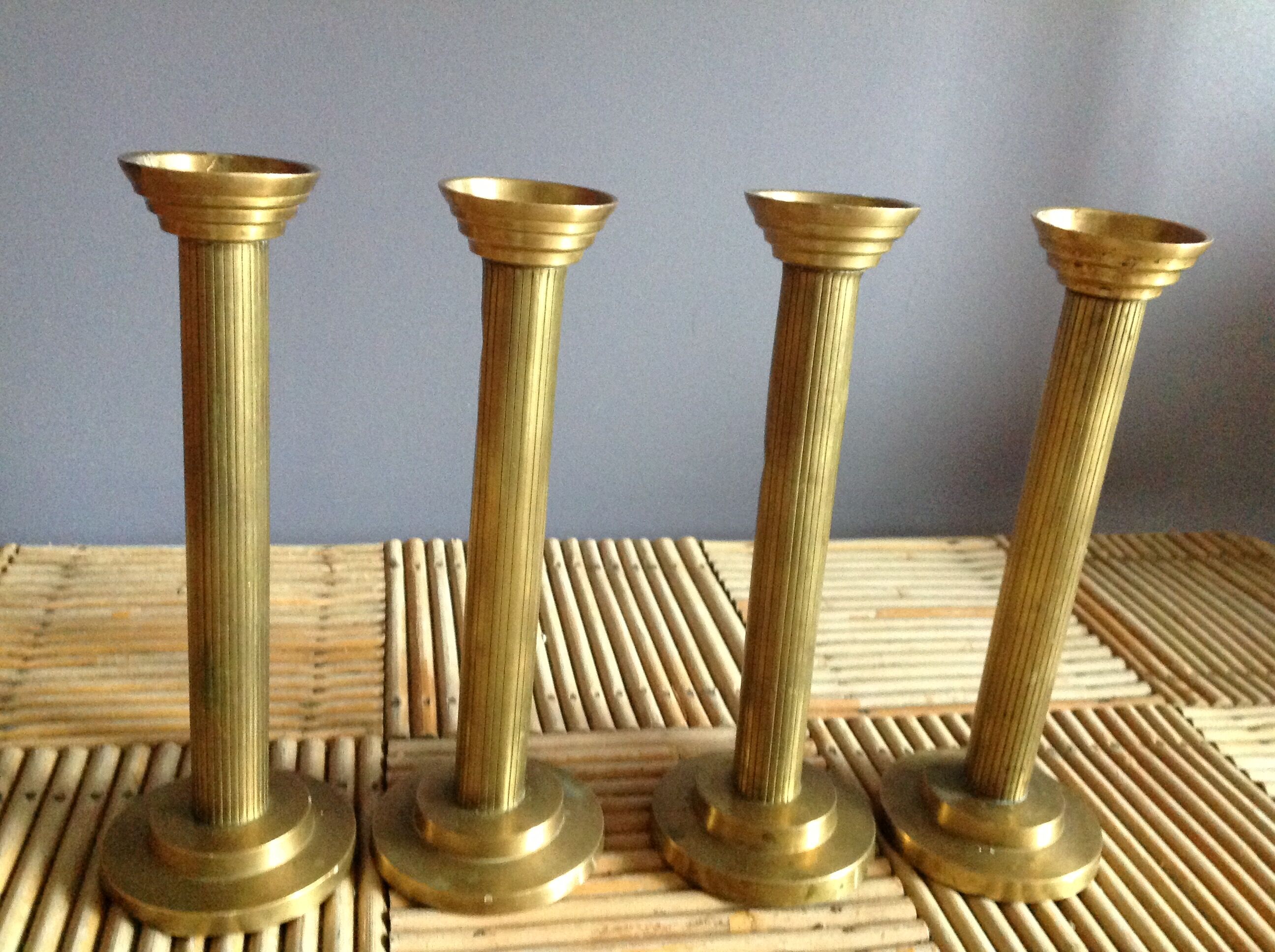 Series of 4 brass candlesticks