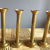 Series of 4 brass candlesticks