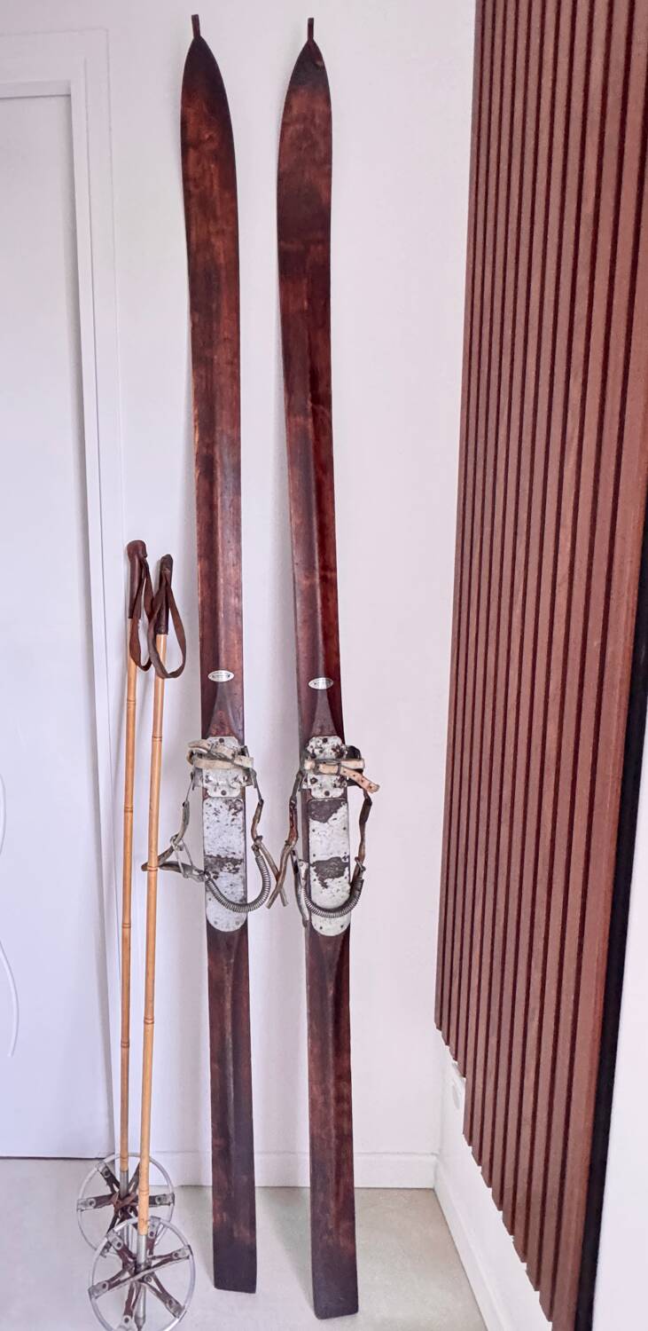 Antique wooden skis with vintage poles