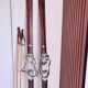 Antique wooden skis with vintage poles