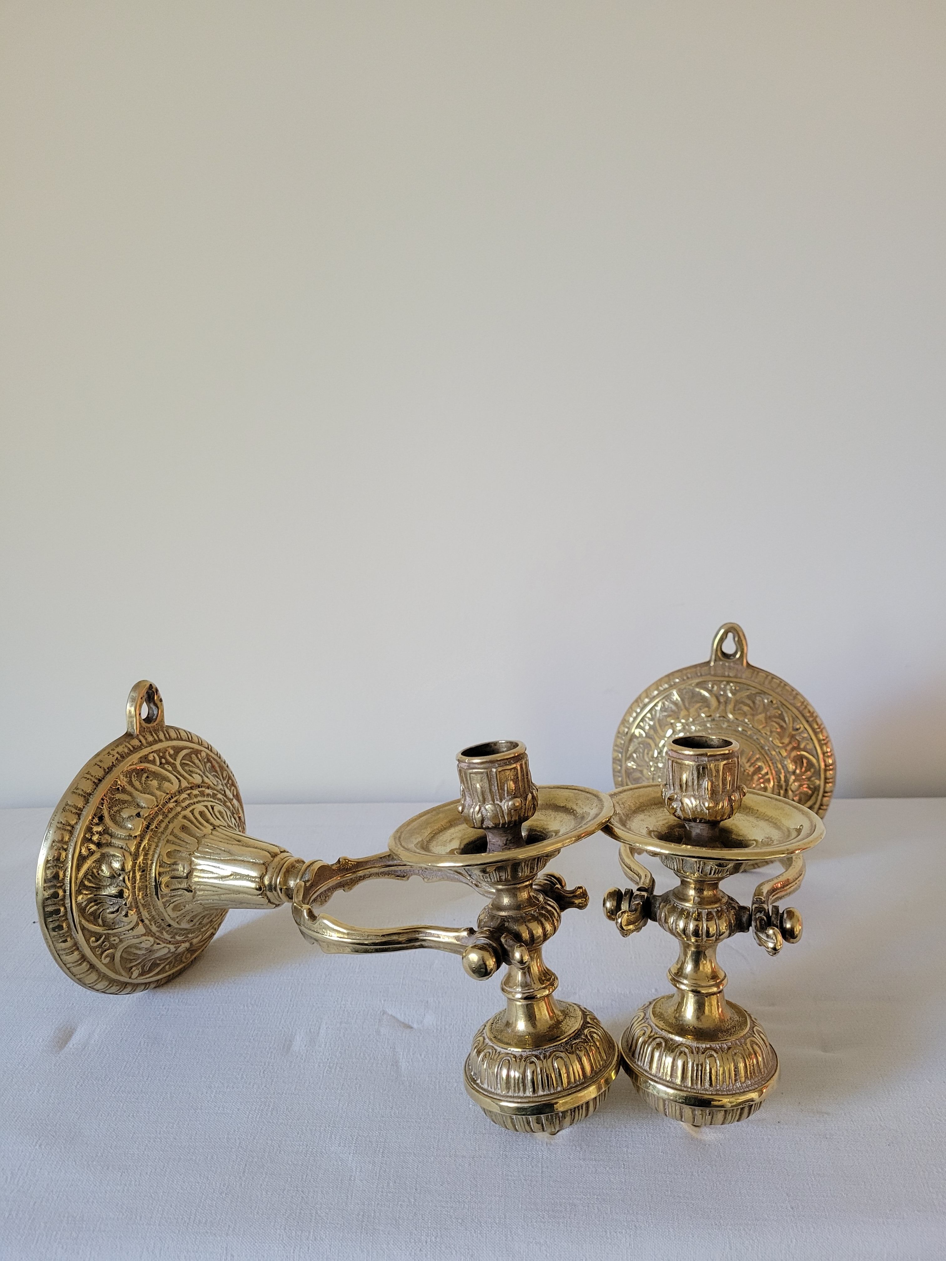 Duo of brass balance wall candle holders