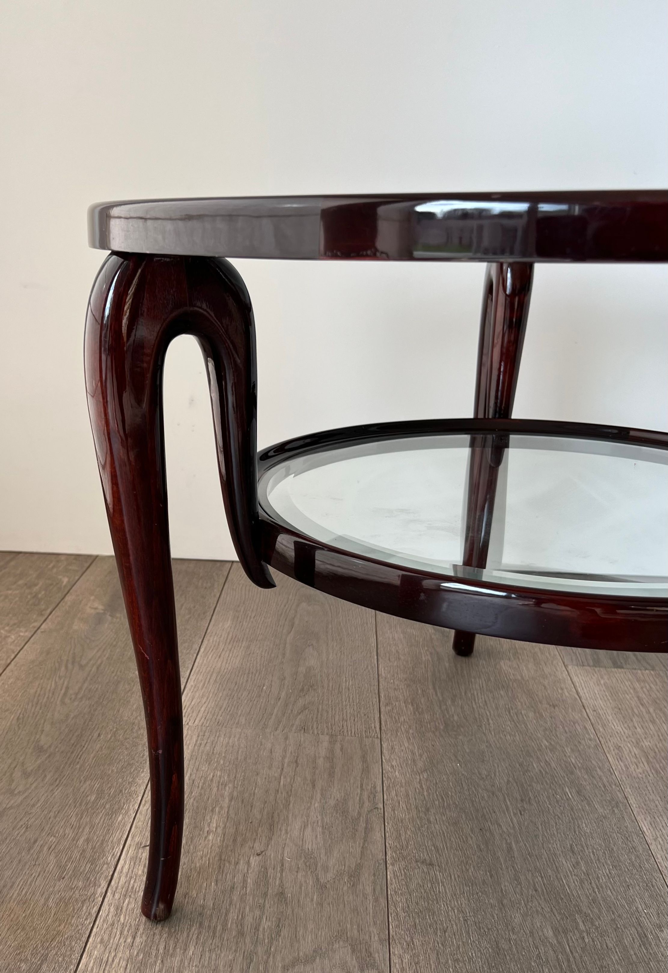 Round mid-century coffee table in walnut with a double top by Paolo Buffa.
