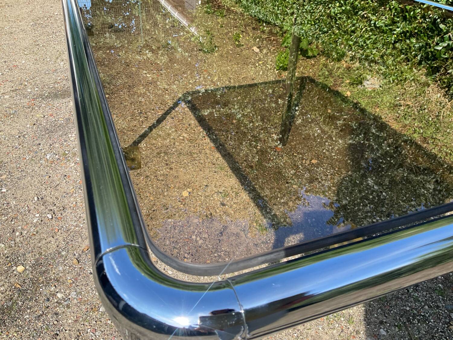70s dining table in tubular chrome metal and smoked glass