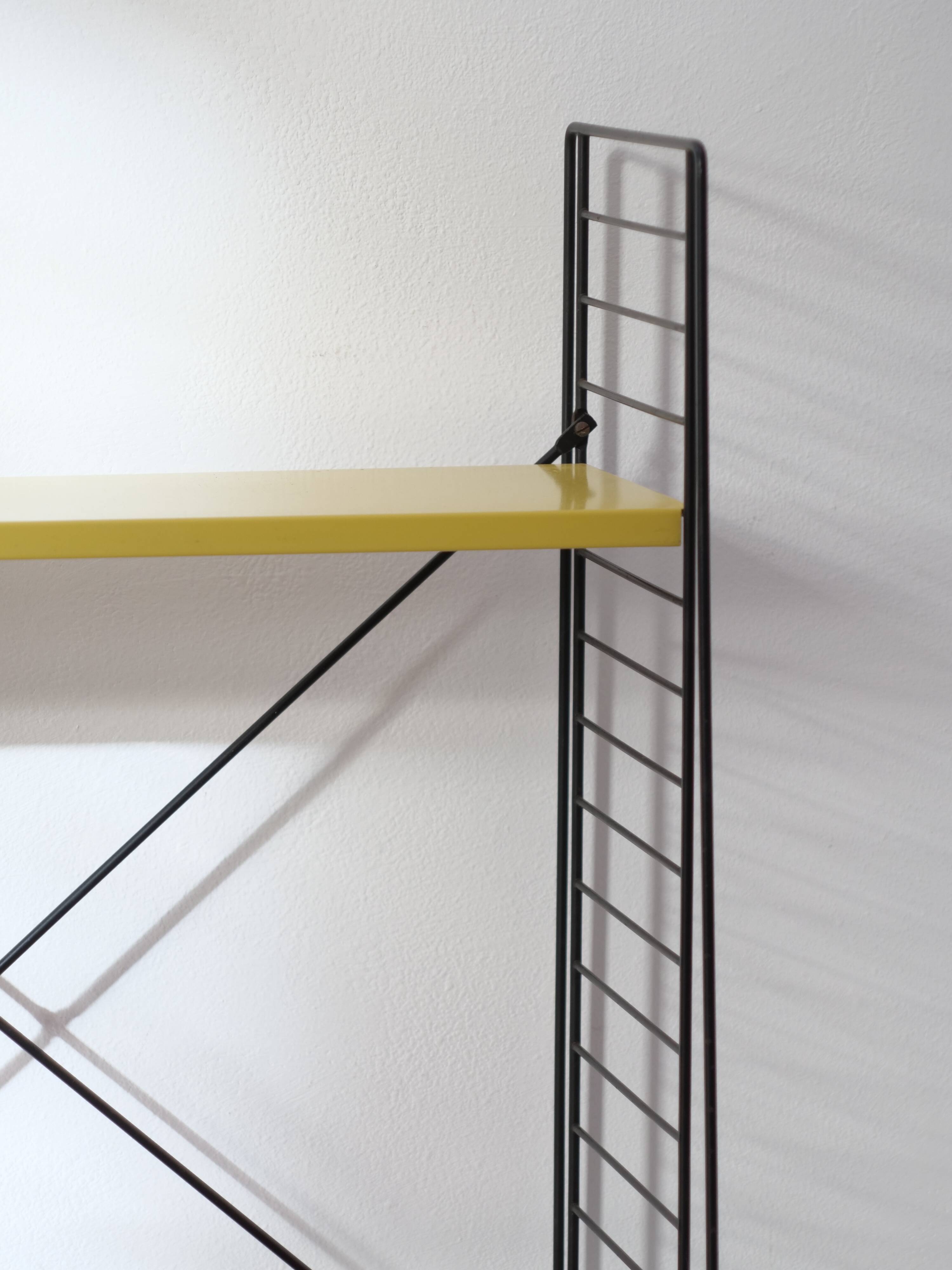Tomado shelf in coloured metal floor shelves from 1958.