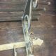 White wrought iron coat and hat rack
