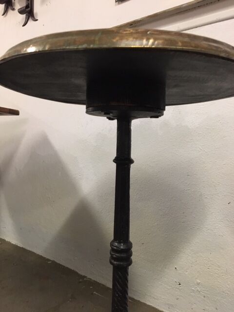 Old foot cast-iron bistro and brass round tray