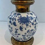 Pair of porcelain lamps with Chinese-style decorations and brass.