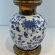 Pair of porcelain lamps with Chinese-style decorations and brass.