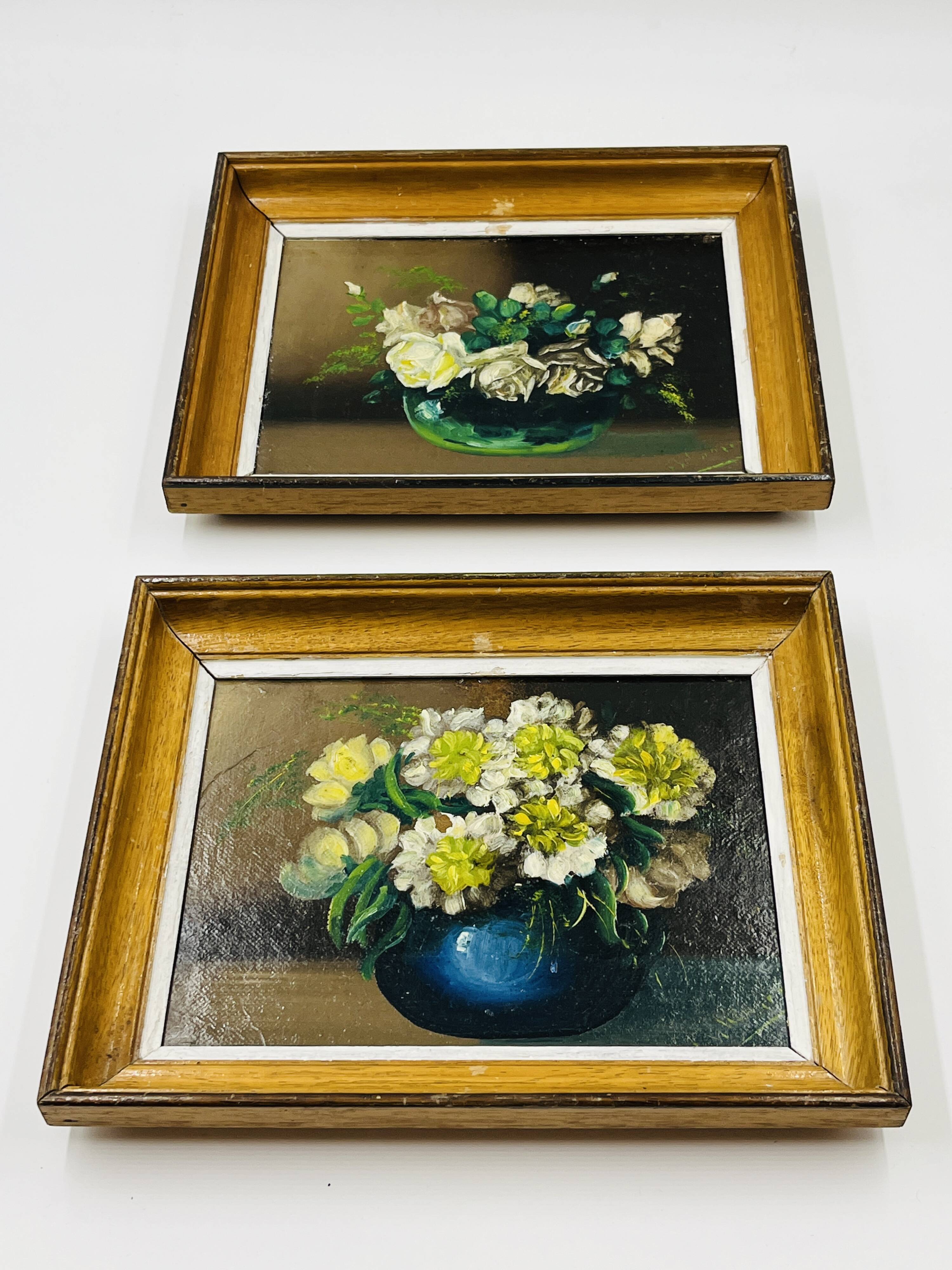 Pair of small framed vintage floral oils