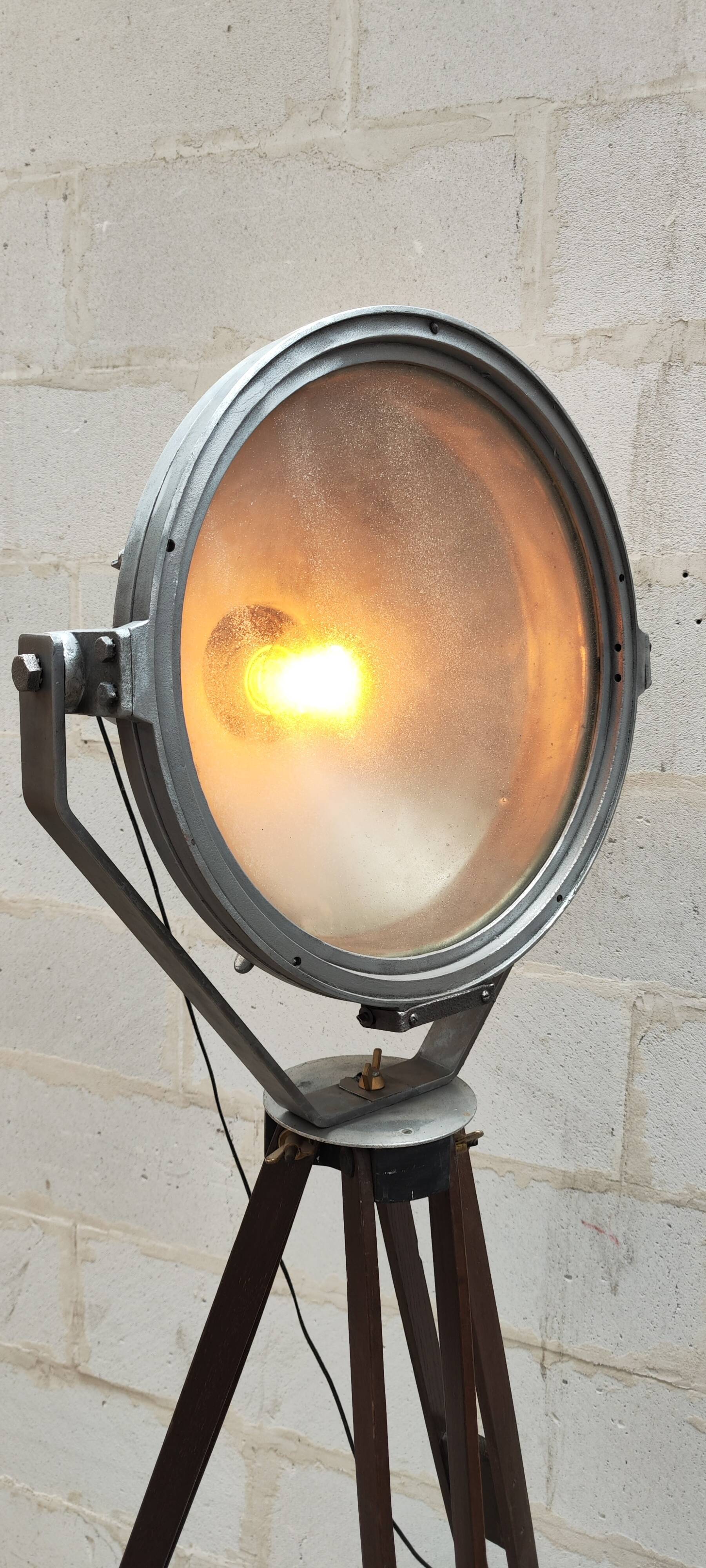 Old Mazda projector on wooden tripod