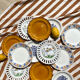 Set of twelve mismatched vintage dessert plates.