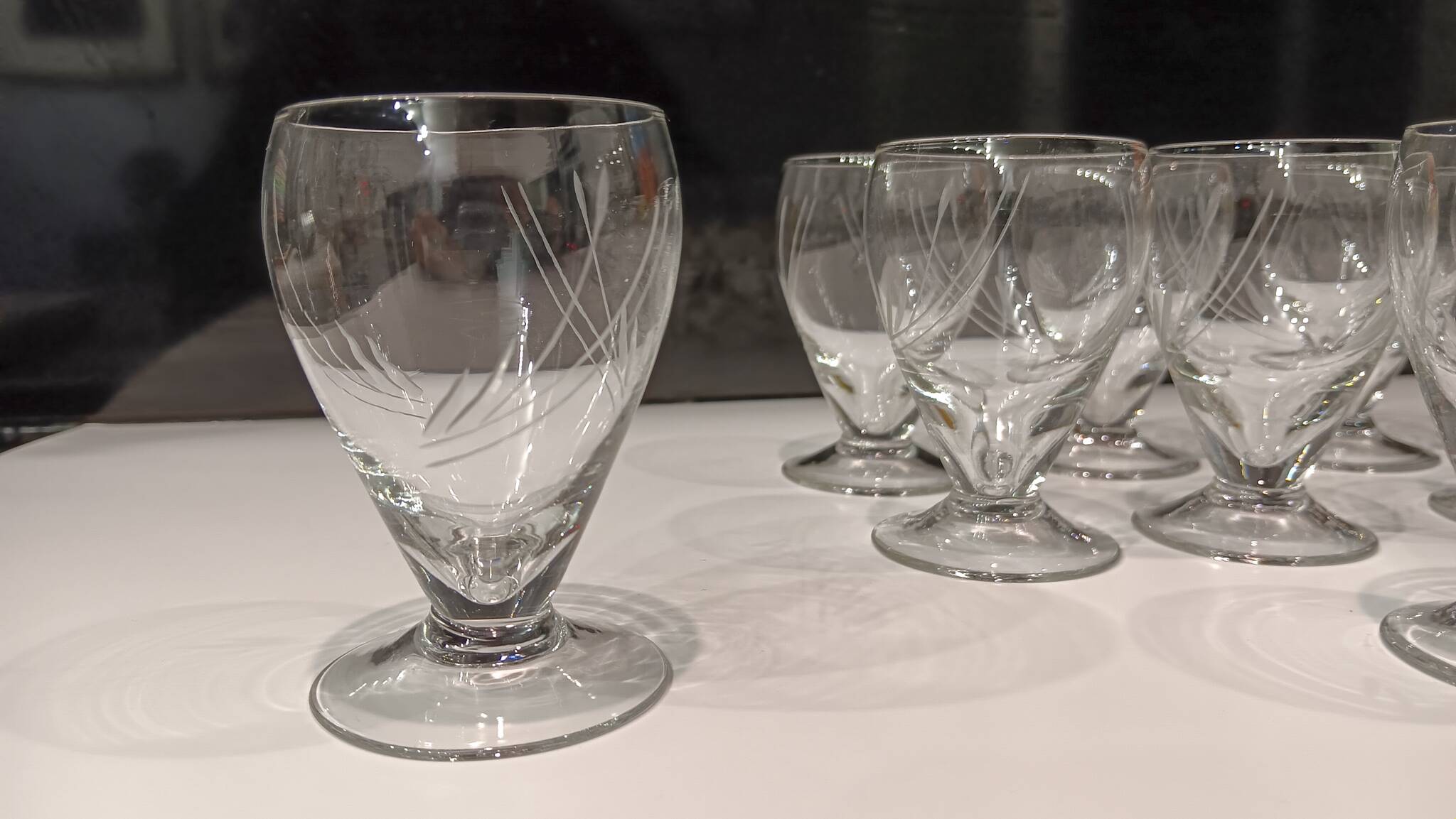 17 small crystal liquor glasses, chiseled pattern - Perfect condition.