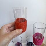 set of 9 small glasses with colored rattan support from the 70s