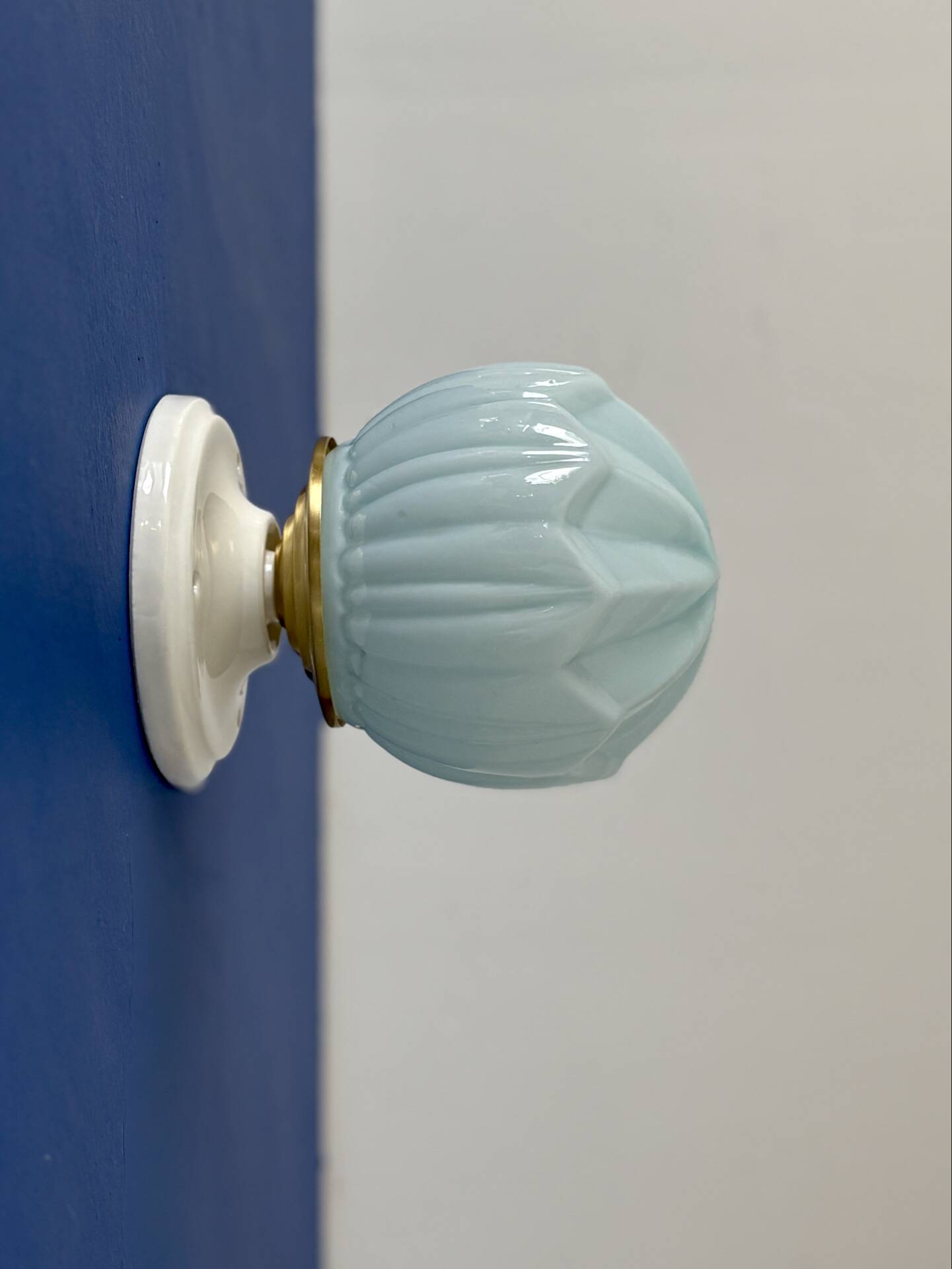 Vintage Art Deco globe wall light in blue opaline.