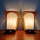 Pair of Philips teak and opaline wall lights, designed by Louis Kalff, 1950