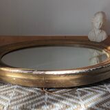 Antique oval gilded stucco mirror