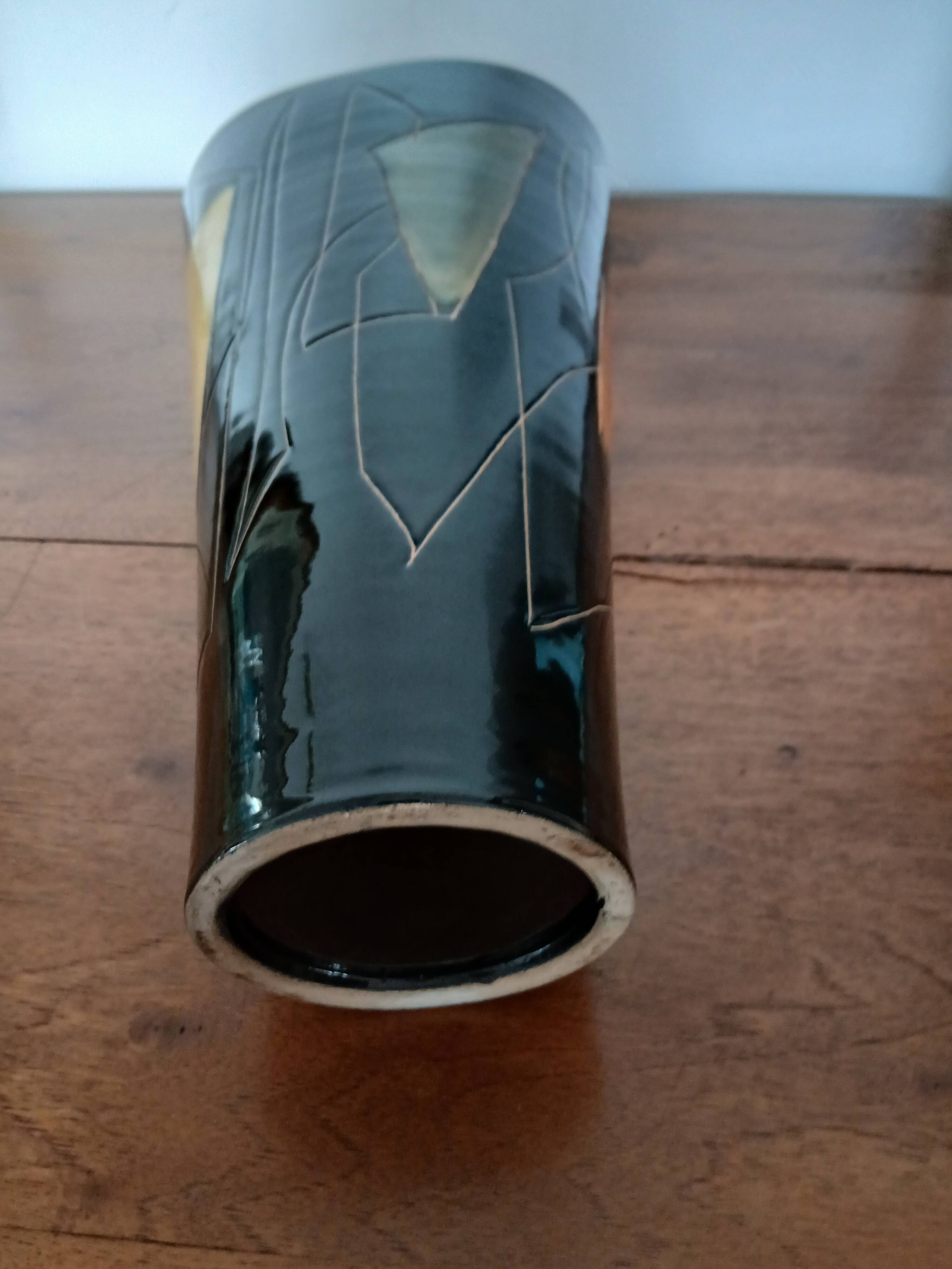 Yellow and black ceramic vase