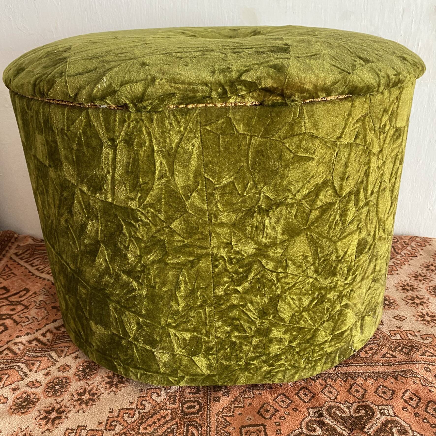 Green velvet storage pouffe from the 1960s.