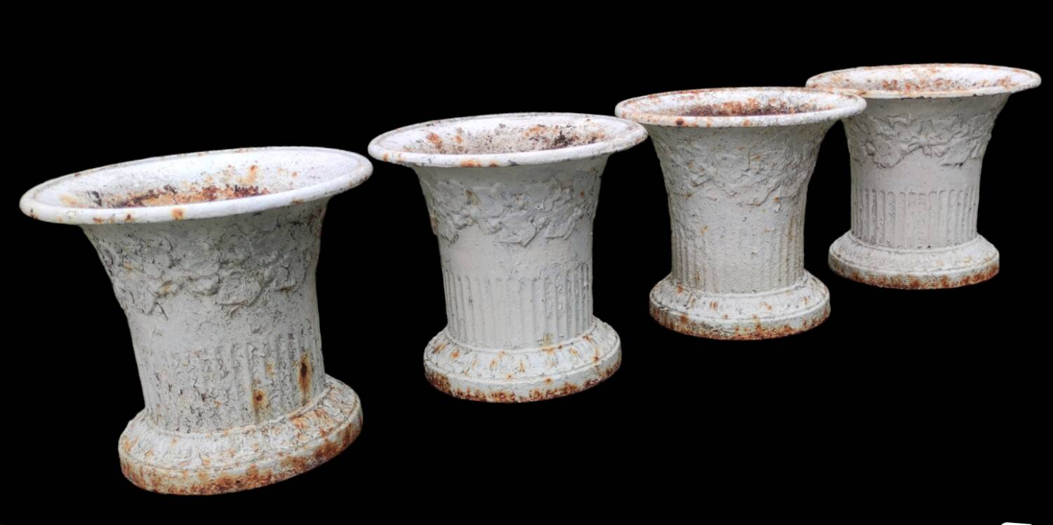 Series of 4 old cast iron vases
