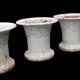 Series of 4 old cast iron vases