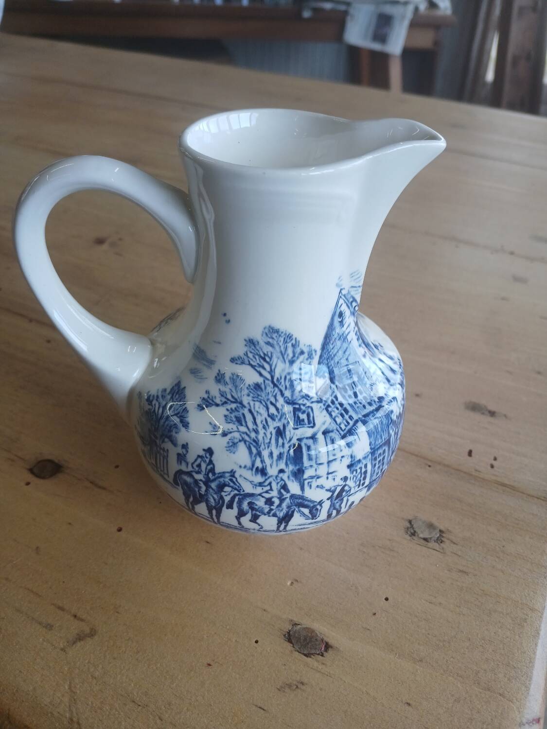 Small old pitcher in iron earth