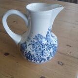 Small old pitcher in iron earth