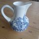 Small old pitcher in iron earth