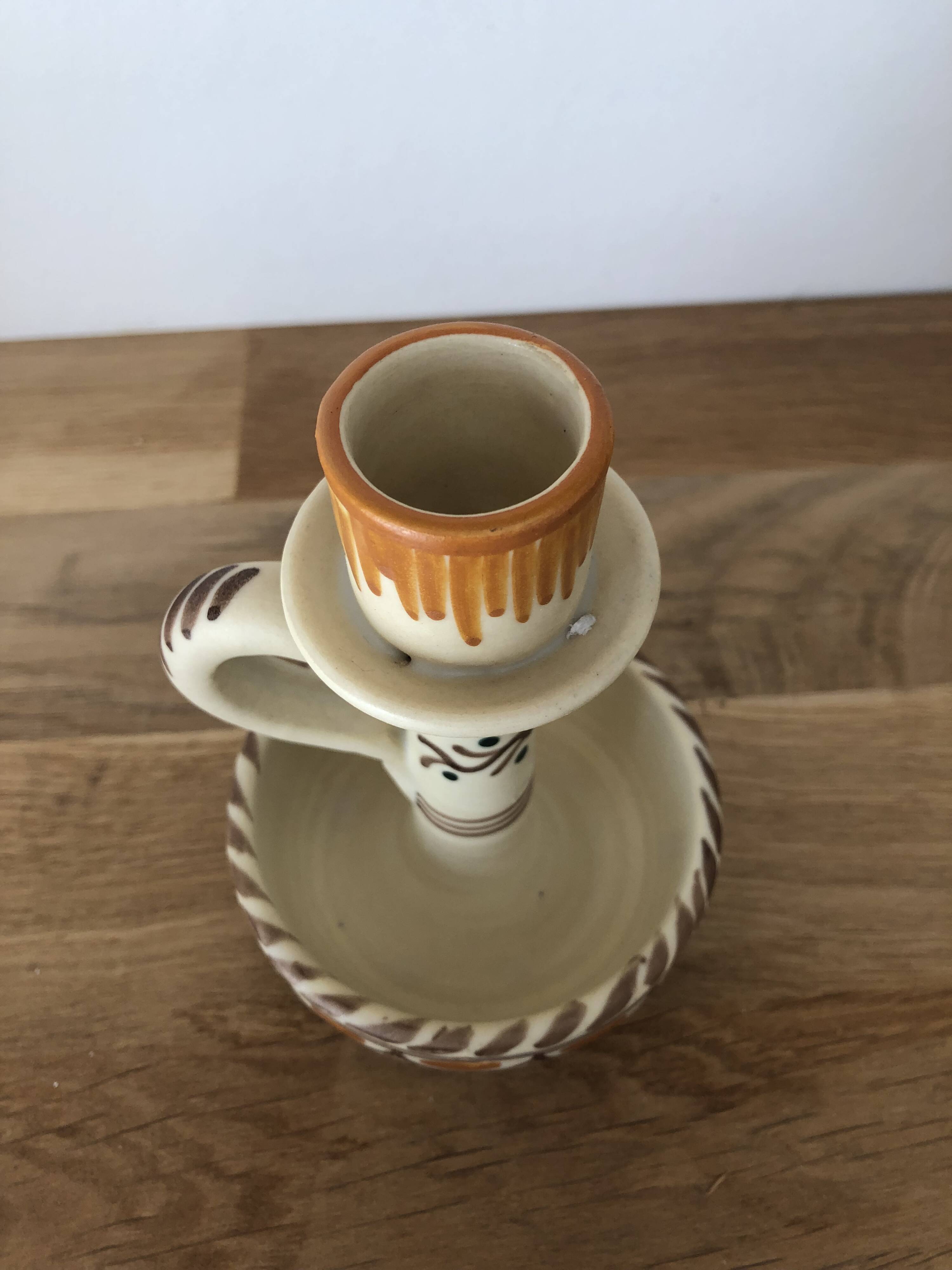 Set of two candlesticks/candle holders in orange and brown tones