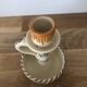 Set of two candlesticks/candle holders in orange and brown tones